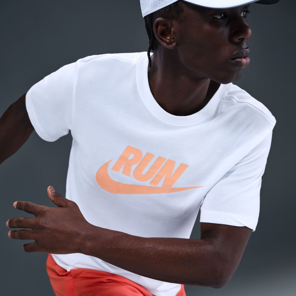 white nike shirt with orange swoosh